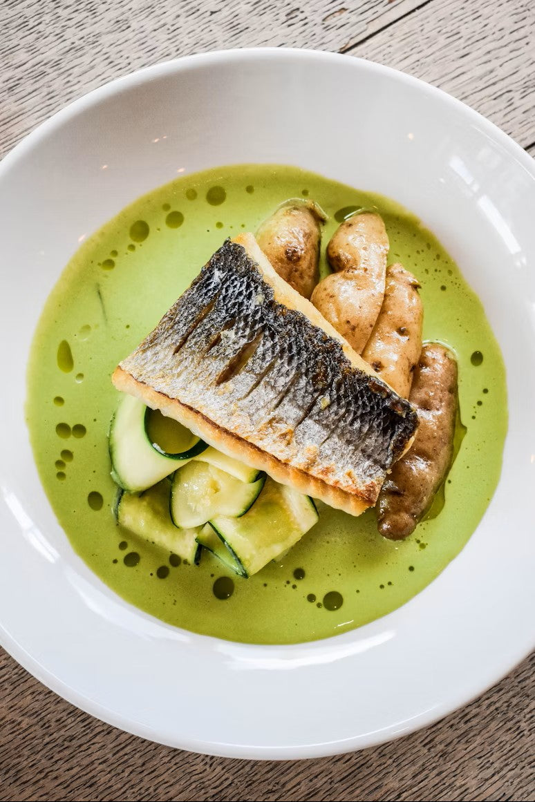 Pan fried barraumundi with roasted kipflers, pickled zucchini and an avocado and verjuice cream sauce.