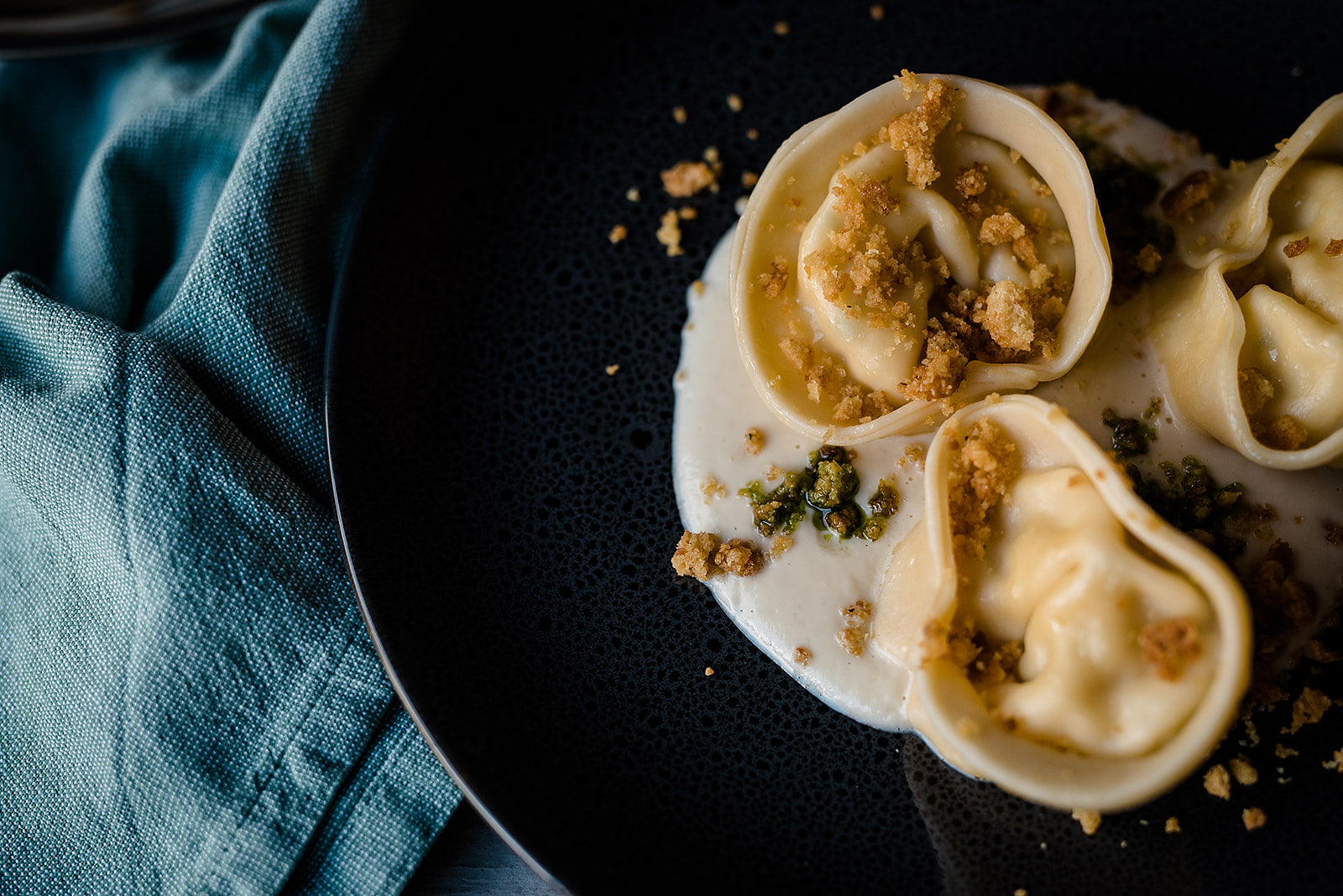 Scallop tortellini, cauliflower velouté & pangratatto