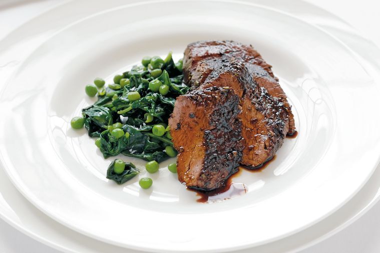 Lamb backstraps with rosemary, honey and red wine pan sauce and wilted greens