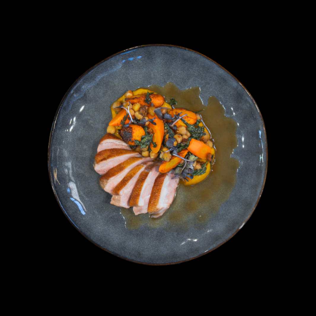 Crispy skinned duck breast, carrots, sauteed spinach, Chickpeas, date infused jus