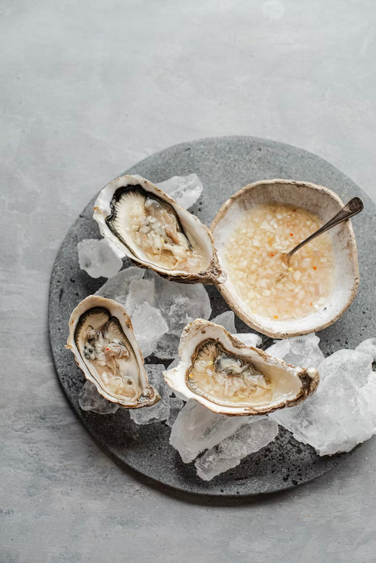 Oysters with light Nahm Jim, eschalot and chilling dressing